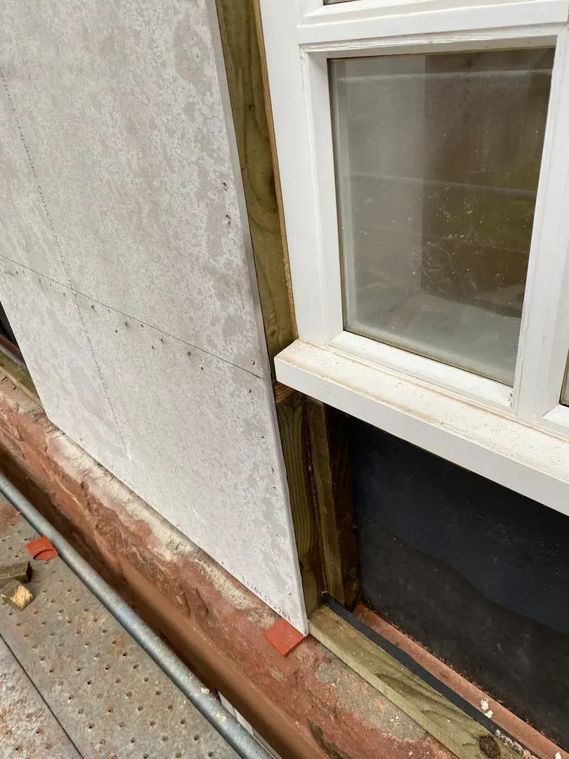 Replacement window being fitted into an external wall