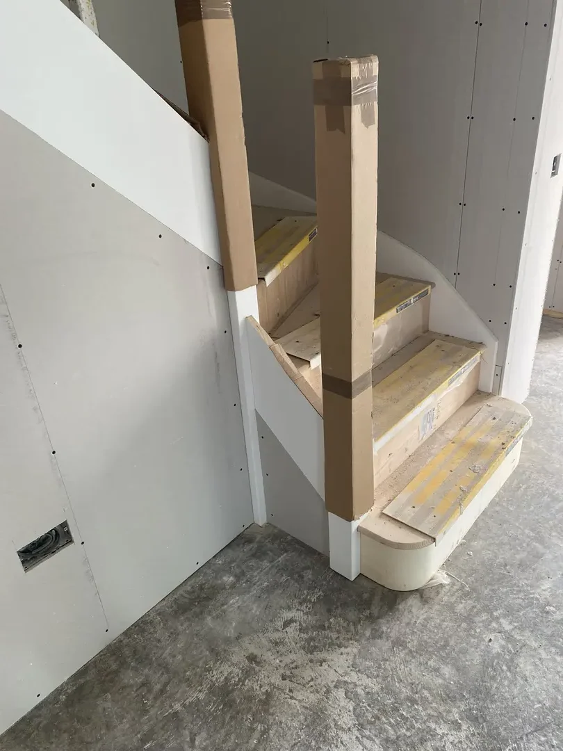 New staircase and surrounding plasterboard during installation