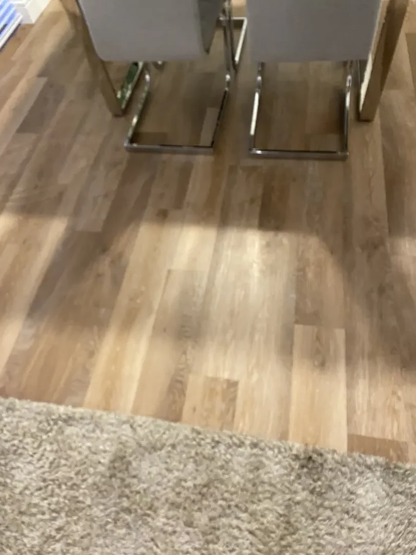 New laminate flooring fitted between adjoining rooms