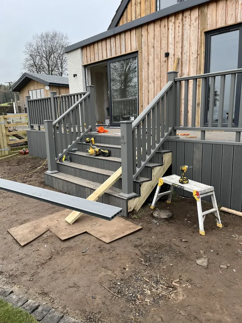 Composite decking and steps fitted to a timber-clad extension
