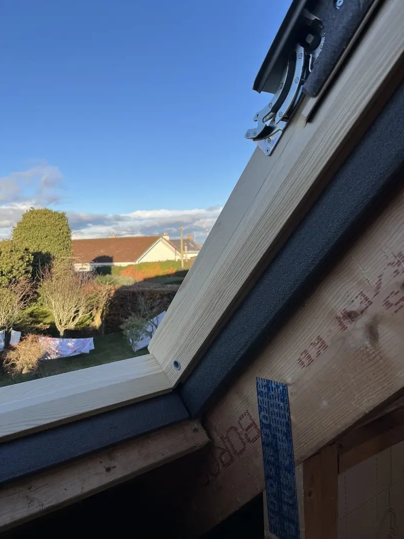 Roof window installation with carefully formed timber lining and cill