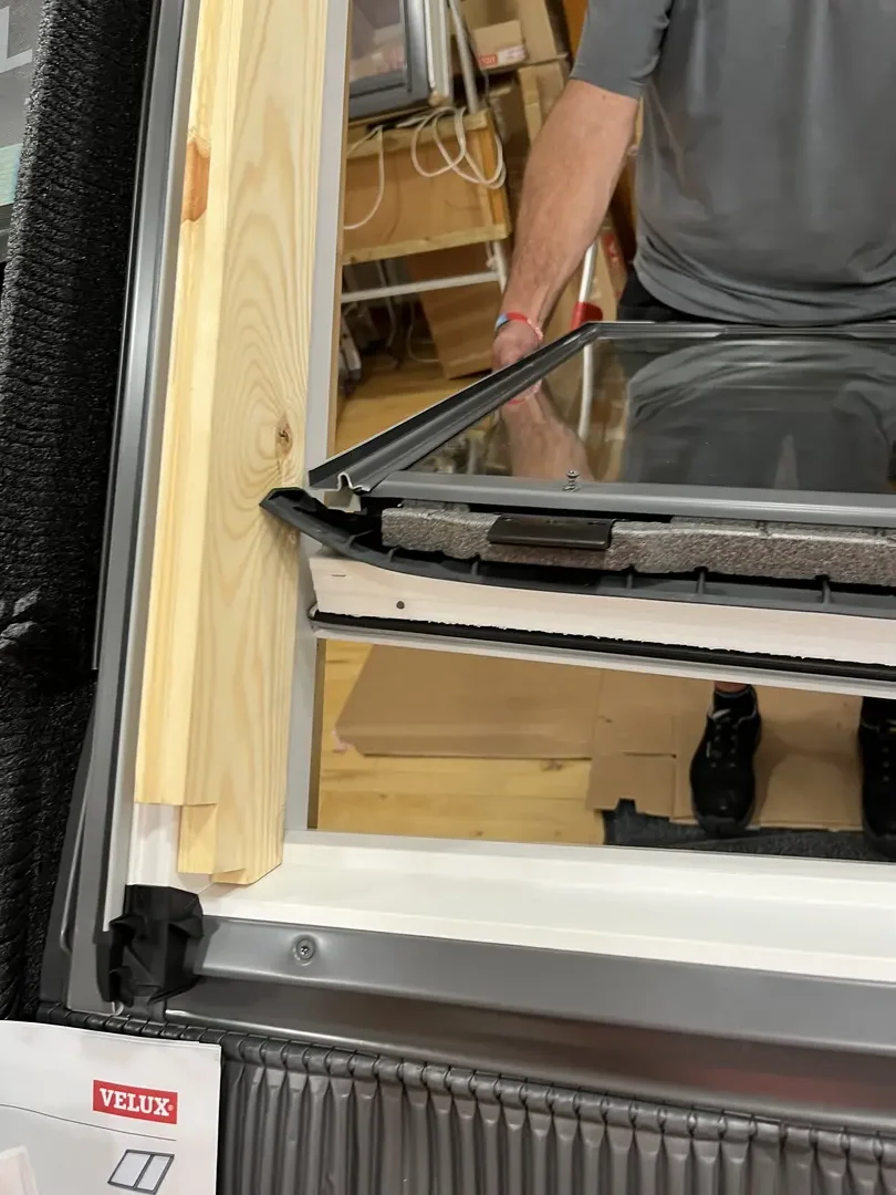 Roof window being fitted and finished from inside the property