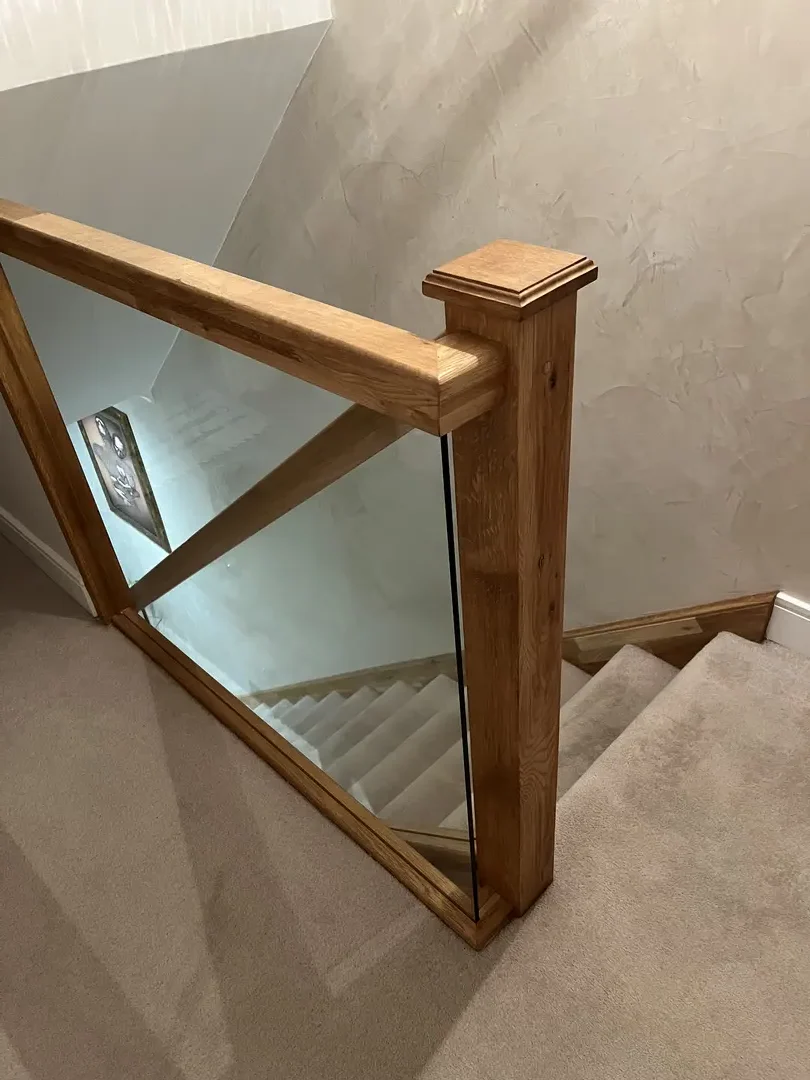 Oak landing handrail with fitted glass balustrade