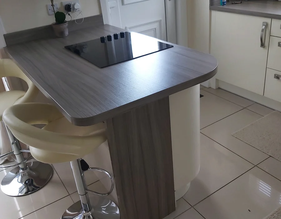Fitted kitchen with island and timber worktops