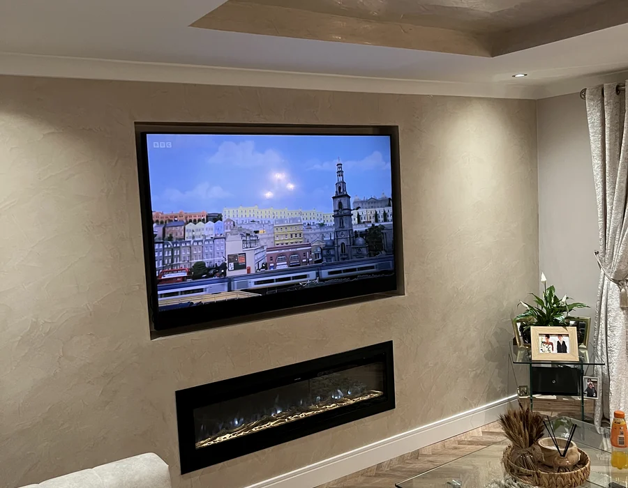 Completed media wall with television and inset fire